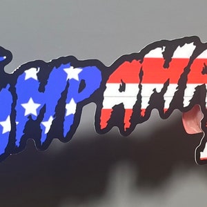 May include: A black and white sticker with the text "TRUMP-MANIA 21" in a dripping font. The text is overlaid with a red, white, and blue American flag pattern.