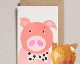Tarjeta de felicitación con globo de papel de cerdo.