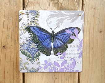 Decorative wooden wall tile with a Motif of a Blue Butterfly