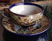 a cup and saucer in satsuma earthenware