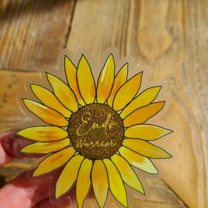 May include: Clear sticker with a yellow sunflower and the text "Endo Warrior" in gold glitter lettering.