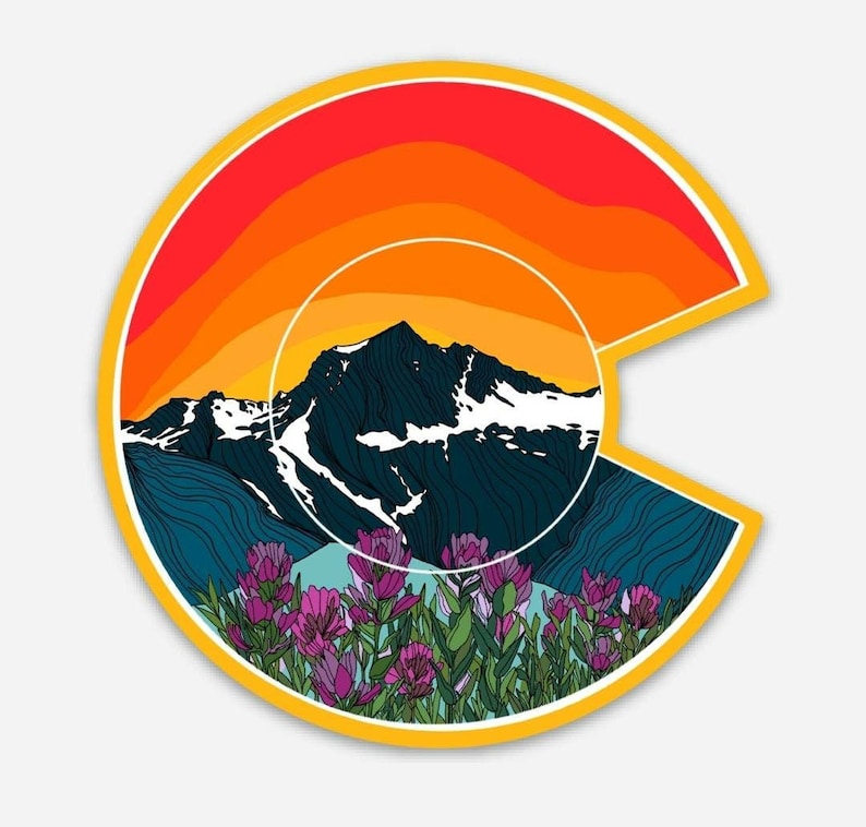 May include: A colorful sticker featuring a stylized outline of the state of Colorado with a mountain range and a sunset in the background. The mountain range is outlined in dark blue and white, with a sunset in shades of orange, red, and yellow. The sticker is surrounded by a yellow border and features a field of purple wildflowers in the foreground.