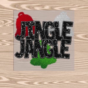 May include: Black glitter text that reads "Jingle Jangle" with a red, green, and white glitter Christmas tree ornament on each side.