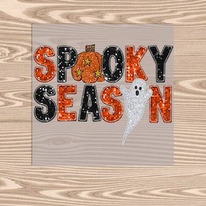 May include: Orange and black glittery letters spelling "Spooky Season" with a pumpkin and a ghost.