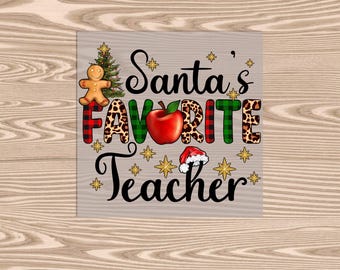 May include: A white background with the text "Santa's Favorite Teacher" in black. The text is decorated with a gingerbread man, a red apple, and a Santa hat.