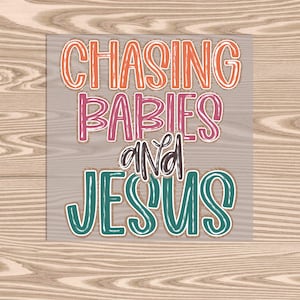 May include: A woodgrain background with a white rectangle containing the text "Chasing Babies and Jesus" in colorful, handwritten lettering.