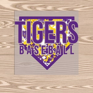 May include: Purple and yellow baseball logo with the word "TIGERS" in a white diamond shape with the words "BASEBALL" underneath.