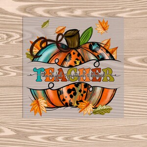 May include: A colorful pumpkin with a leopard print design and the words "Teacher thankful grateful & blessed" on a white background with fall leaves.
