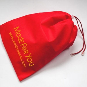 Made For You shoe bag in red or off-white color is included with each pair. It is made out of recycled cotton fibers.