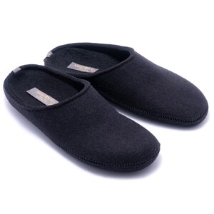 Women 100% wool slippers with arch support insoles and rubber soles. Home shoes are comfortable and help feet to rest. Women's slippers are black color with natural fibers that prevent feet from sweat and odors