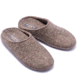 100% wool slippers with rubber soles in various widths and fits. Home shoes are comfortable due to arch support and natural fibers. Women's slippers are brown and dark beige melange color in natural fibers that prevent feet from sweat and odors