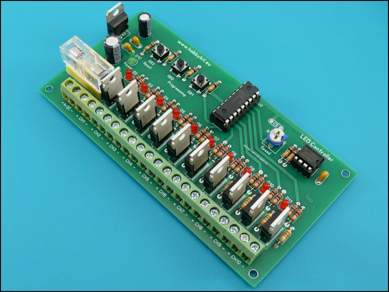 May include: A green circuit board with an LED controller. The board has a row of 10 screw terminals labelled CH1 through CH10. There are also several red LEDs and a small potentiometer labelled "Speed". The text "LED Controller" is printed on the board.