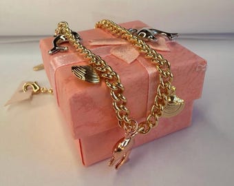 Stainless steel Dolphin & Seashell Charm Bracelet.
