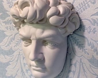 A Plaster Wall Plaque Of Michelangelo's Sculpture Of "DAVID"