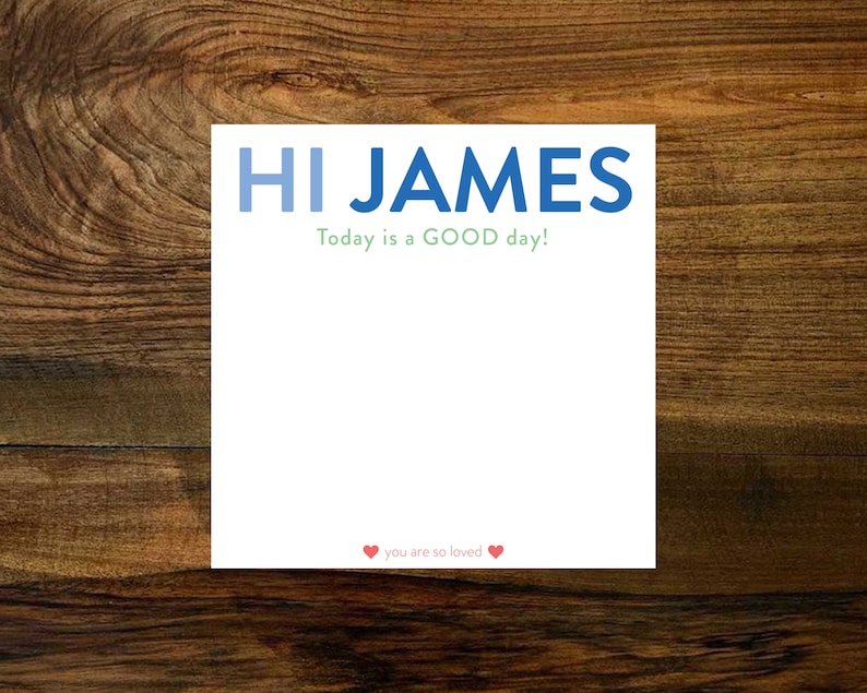 May include: White card with blue text that says "HI JAMES" and green text that says "Today is a GOOD day!"  There are two red hearts at the bottom with the text "you are so loved".