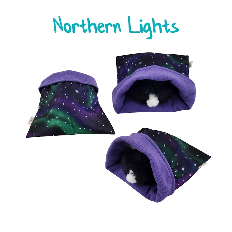 May include: A purple fleece pet bed with a black and green aurora borealis print. The bed is shown in three different positions, with one position showing a stuffed animal inside the bed.