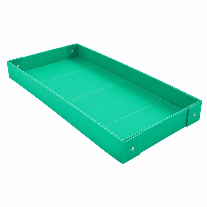 May include: A rectangular tray in a vibrant emerald green color. The tray features raised sides and visible structural seams along the interior base. Small, metallic silver-toned rivets are positioned at the corners of the exterior frame.