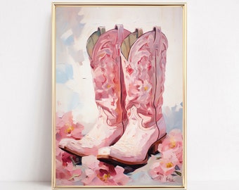 May include: A framed painting featuring two pink cowboy boots with floral patterns. The boots are depicted against a backdrop of soft pink and white brushstrokes, with pink flowers at the base. The artwork is presented in a gold frame.