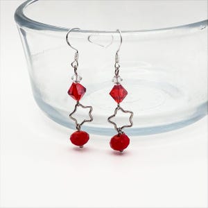 Red crystal star dangle earrings