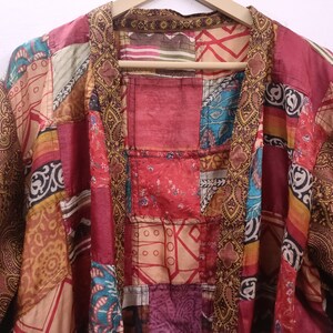 "Boho-chic silk kimono featuring a lively patchwork of colors"