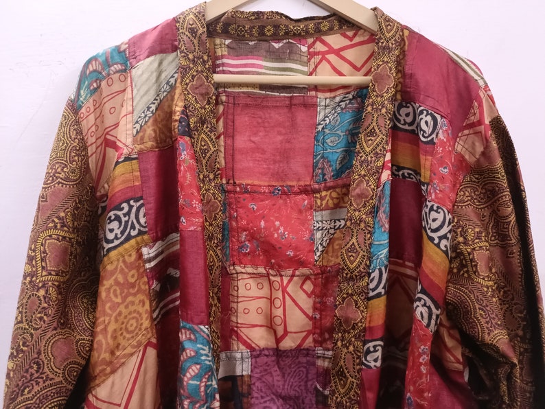 "Boho-chic silk kimono featuring a lively patchwork of colors"