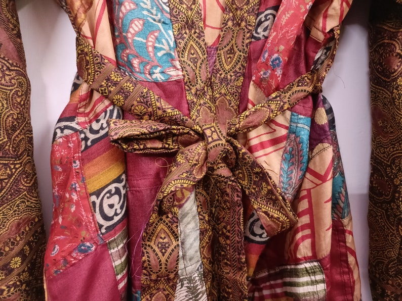 "Luxurious silk kimono adorned with a patchwork of brilliant hues"