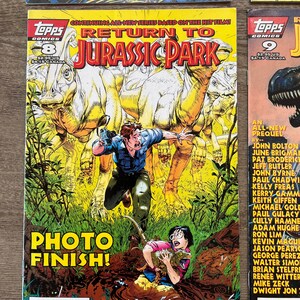 May include: A comic book cover featuring a green dinosaur with a red stripe on its back. The title of the comic is "Return to Jurassic Park" and the issue number is 9. The comic is published by Topps Comics.