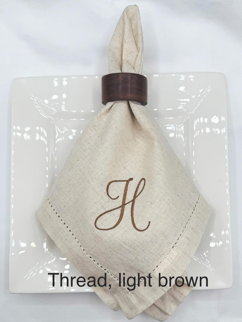 May include: A rustic wooden sign with the text "Welcome to our home" in white lettering. The sign features a distressed finish and a simple, inviting design, perfect for entryway decor.