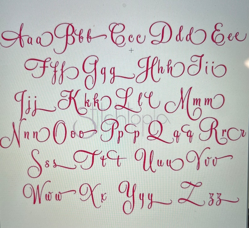 May include: A red, handwritten alphabet in both uppercase and lowercase letters. The letters are displayed in a cursive font style, with each letter carefully crafted. The letters are arranged in rows and columns, showcasing the full alphabet.
