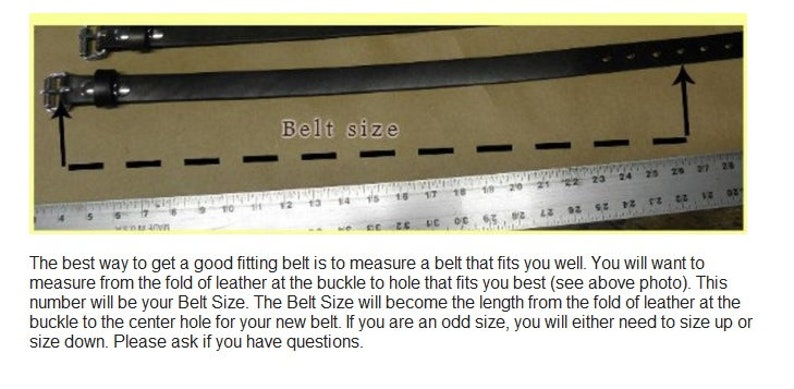 May include: A close-up of a black leather belt with multiple holes and a metal buckle. A ruler is visible below the belt, with the text "Belt size" written above the belt. The text below the image explains how to measure a belt for the correct size.