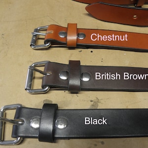 May include: Three leather belts with silver buckles in chestnut, British brown, and black.
