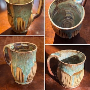 May include: Handmade ceramic mug with a unique design. The mug features a tan base with vertical lines and a turquoise and brown glaze that drips down the sides. The handle is a matching brown color. The text "Nourish Your Slow Living Rituals" is at the bottom.