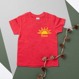 Sun Sister Matching Family Sibling Shirts. Sibling. Brother. Cousin. Toddler. Youth. First Trip Around the Sun Pocket Logo T-Shirt. image 8
