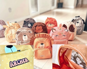 May include: A collection of 10 colorful animal-themed backpacks with various designs, including a giraffe, lion, bear, unicorn, and dog. The backpacks are made of soft, plush fabric and have a zipper closure. The backpacks are arranged in a row on a light-colored surface.