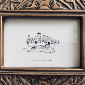 May include: A black and white line drawing of a sculpture in a park, with a cityscape in the background. The text "Minneapolis Sculpture Garden" is below the drawing.