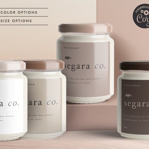 May include: Three glass candle jars with labels that say "segara co." and different scents: Rosemary, Wood, and Cinnamon. The jars are on a wooden surface. The text "PERSONALIZE WITH Coryl" is in the top right corner of the image.