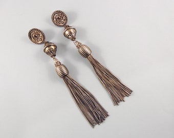 Large, long, tassel earrings, copper gold tone, statement earrings, spinx icon on earring tab, vintage earrings, special occasion earrings.