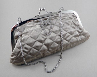 Quilted fabric beige evening purse with a decorative silver butterfly decoration, purse with silver chain, elegant evening clutch bag,