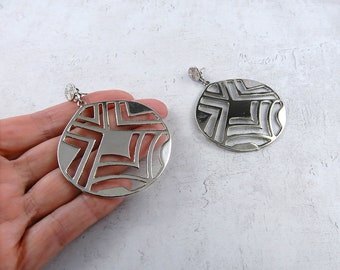 Large silver tone round earrings with a geometrical design, sixties inspired statement earrings, drop and dangle earrings, vintage earrings.