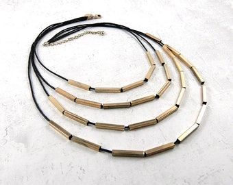Back cord necklace with  small gold square gold metal tubes, gold four strand necklace, vintage necklace, 1990-2000.