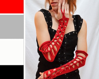 May include: Red elbow-length gloves with a criss-cross design. The gloves are made of a stretchy fabric and have a close fit.
