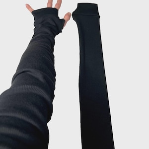 Lange Schwarze fingerlose Handschuhe Baumwollgewebe Rippenstrick Armstulpen Weiße Armstulpen Armstulpen Armstulpen Armstulpen TRIXY XCHANGE Bild 1