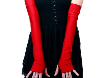 May include: A pair of long, red satin gloves. The gloves extend to the elbow and have a fitted, stretchy design.