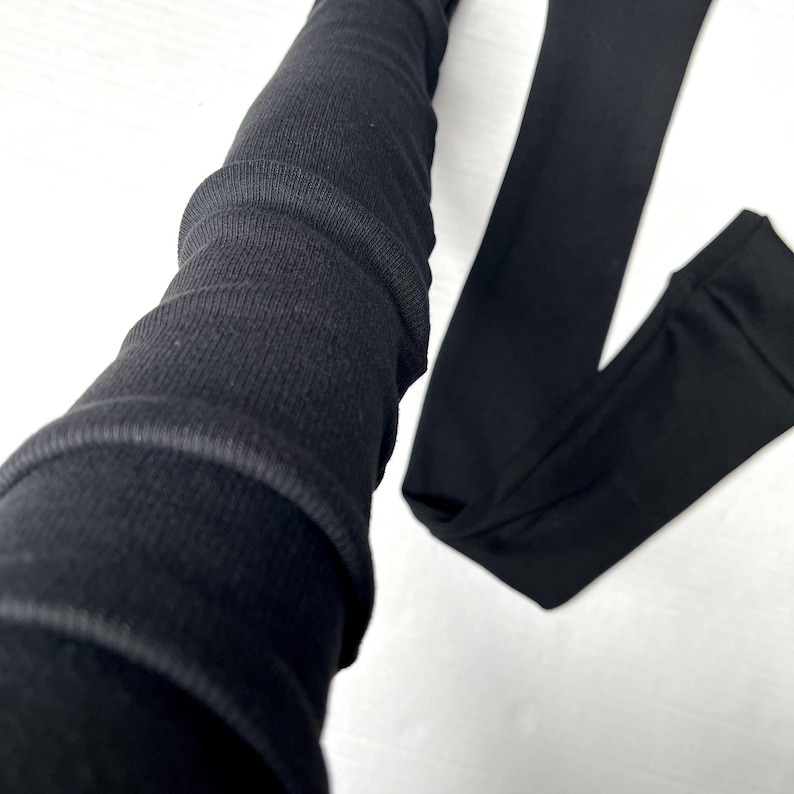 Lange Schwarze fingerlose Handschuhe Baumwollgewebe Rippenstrick Armstulpen Weiße Armstulpen Armstulpen Armstulpen Armstulpen TRIXY XCHANGE Bild 4