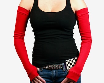 May include: A pair of red long fingerless gloves with a black tank top and blue jeans.