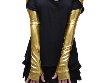 May include: A pair of long, gold metallic fingerless gloves. The gloves are made of a shiny, stretchy material and have a fitted design.