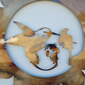 May include: A metal wall art piece depicting a hummingbird in flight with a flower and a bird perched on a branch. The art is set against a white background and surrounded by a sunburst design.