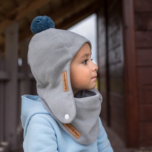 SET. Children's winter cap with a pompom and scarf Grey + blue pompom