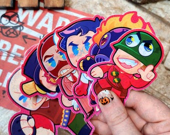 May include: A collection of colorful cartoon character stickers with pink borders. The stickers feature various characters with distinct facial expressions and outfits. One sticker has a green helmet and a red uniform. The background includes a sign with the word "WAR" and a cartoon face.