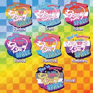 May include: A collection of colorful stickers featuring a cartoon dinosaur skeleton. Each sticker has a different background color and text, including "You're allowed to take up space" and labels like "Rainbow," "Trans," "Lesbian," "Bisexual," "Pansexual," "Nonbinary," and "Asexual."